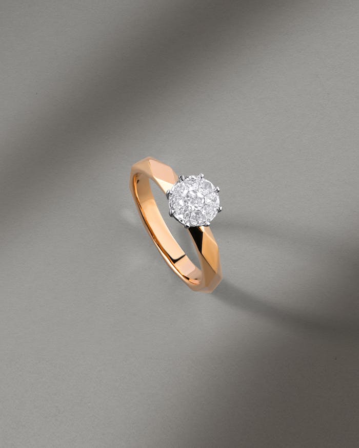 A beautifully crafted diamond ring with a rose gold band, perfect for elegant and sophisticated occasions.