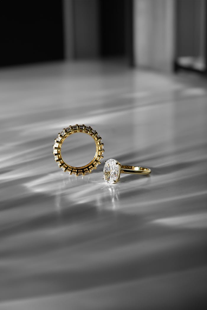services-01 Close-up of luxury gold and diamond rings with a modern aesthetic, perfect for weddings and fashion.