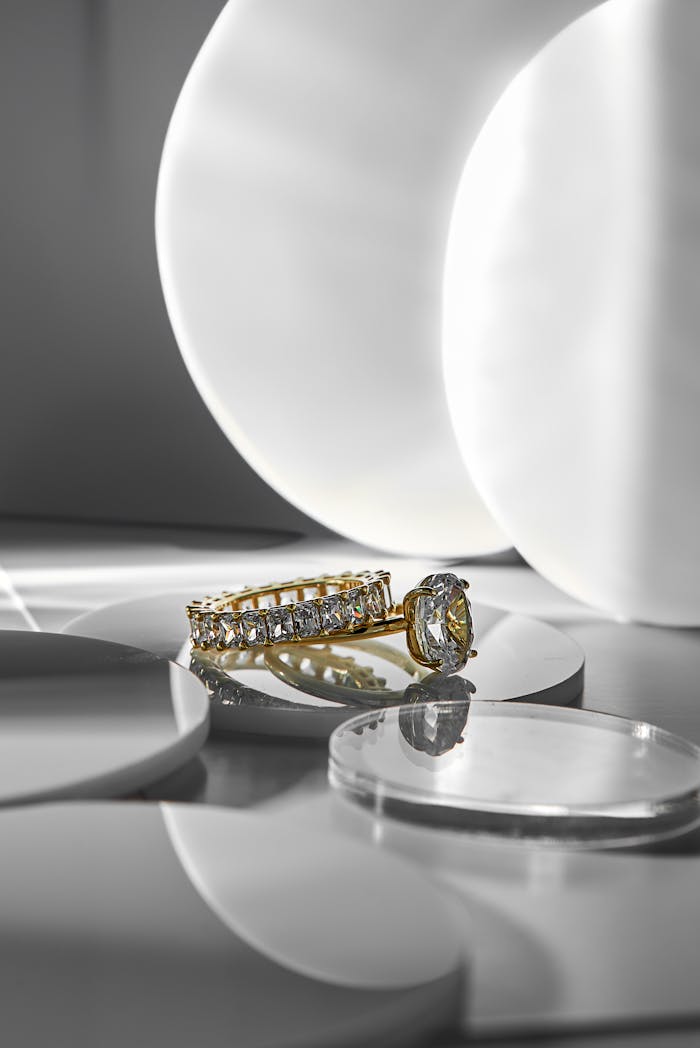 services-02 Gold and diamond rings elegantly displayed on a minimalist background with a modern aesthetic.
