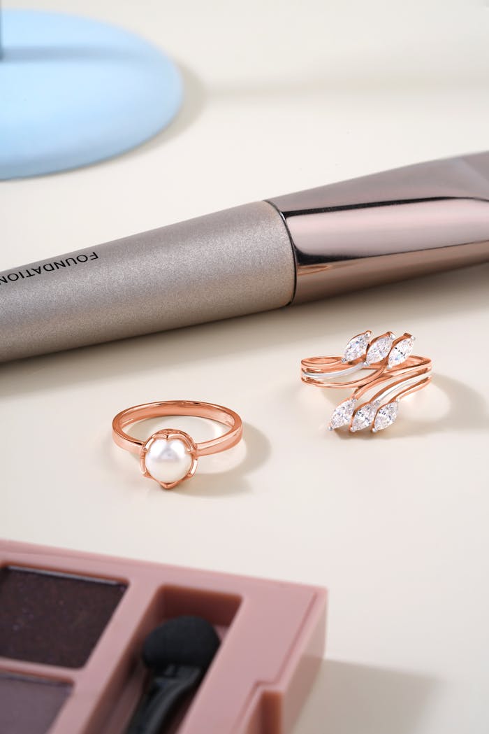 services-01 A chic display of pearl and diamond rings with makeup accessories.